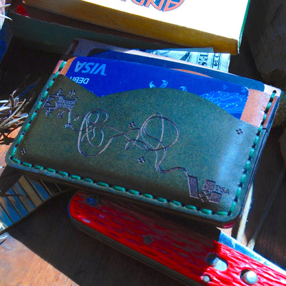 Unique minimalist wallet with five slots.  Variant 1. Sown by hand. Made with full grain vegetable-tanned leather. Alternative Front view with cards.