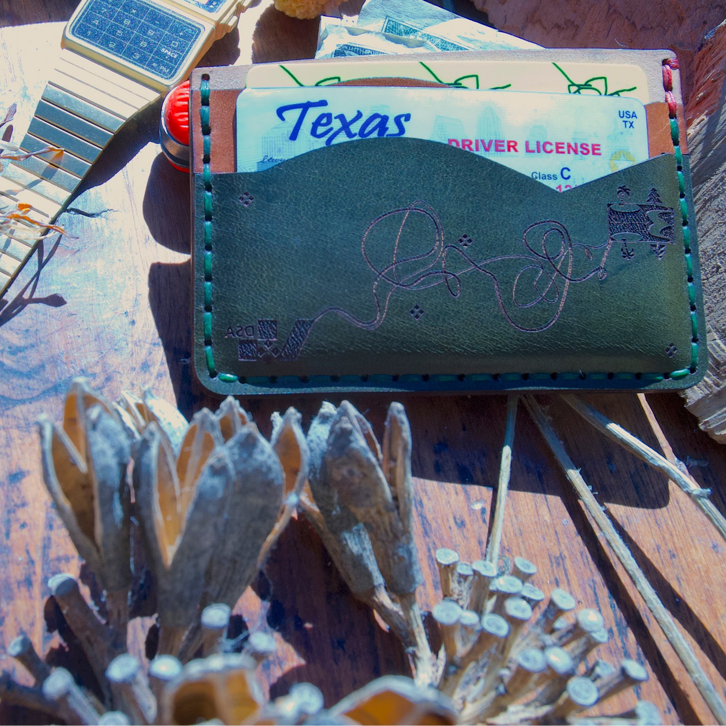 Unique minimalist wallet with five slots.  Variant 1. Sown by hand. Made with full grain vegetable-tanned leather. Back view with cards.